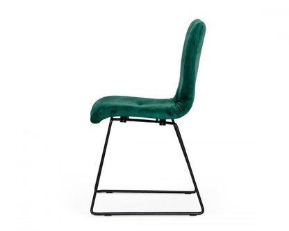 Set of two emerald green upholstered fabric dining side chairs with cushioned seats and curved backs, black metal sled bases.
