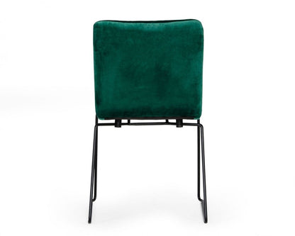 Set of two emerald green upholstered dining side chairs with black metal legs and square backs.