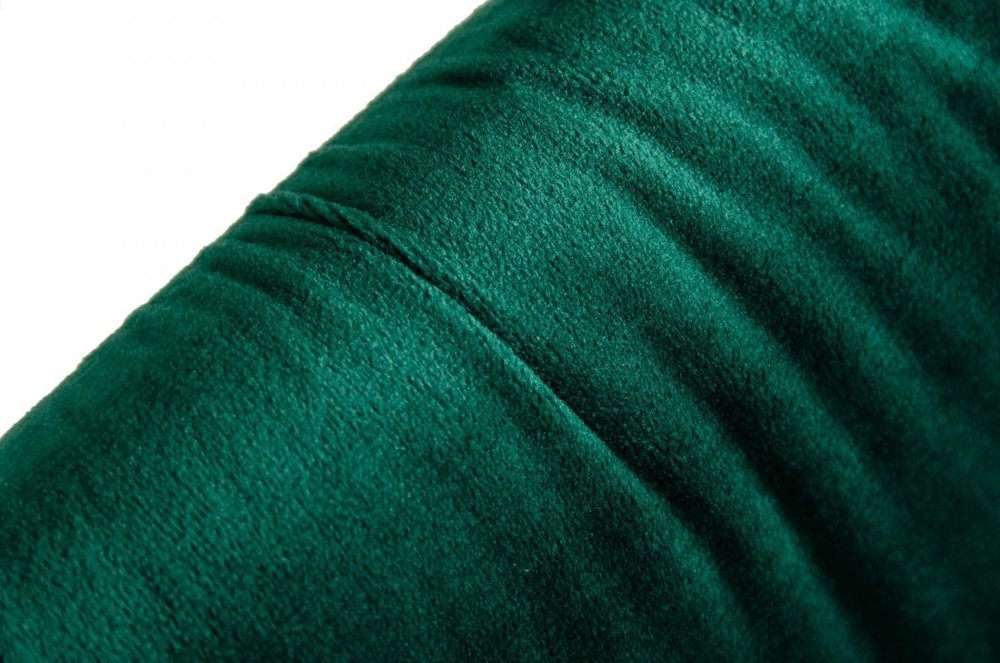 Close-up of emerald green velvet fabric with a seam & soft nap, ideal for upholstery.