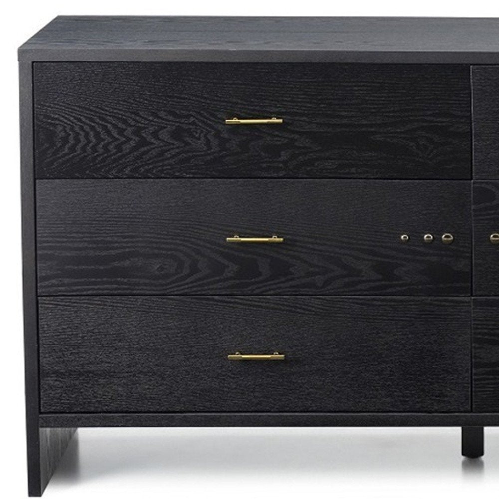 Grey ash manufactured wood six-drawer double dresser with gold bar pulls and visible grain.