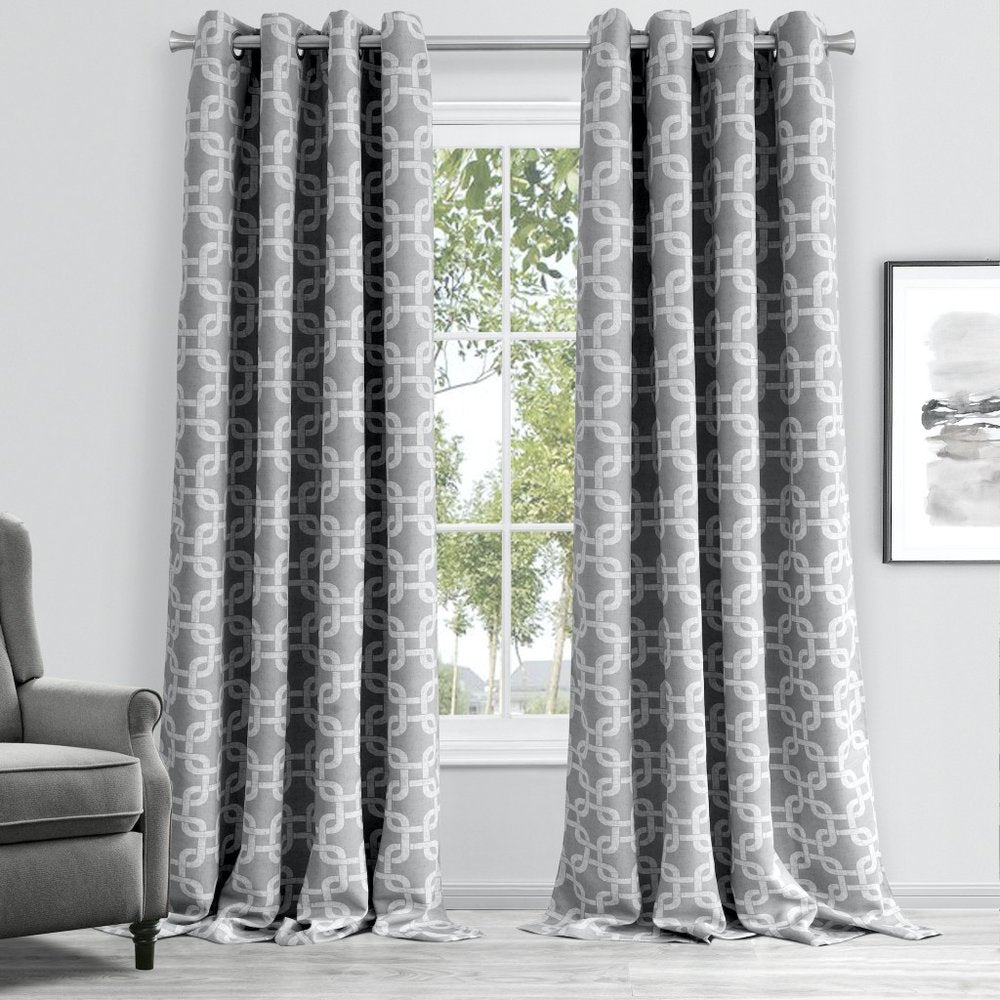 Soft silver-grey fabric window curtain panel with a white interlocking chain pattern, floor-length for a modern living room window