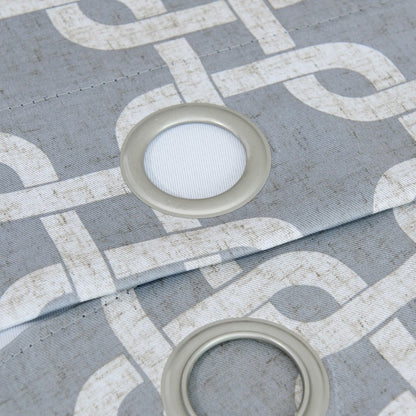 Gray interlock-pattern window curtain panel fabric with a white geometric pattern and two circular light-gray grommets with white ribbed centers.