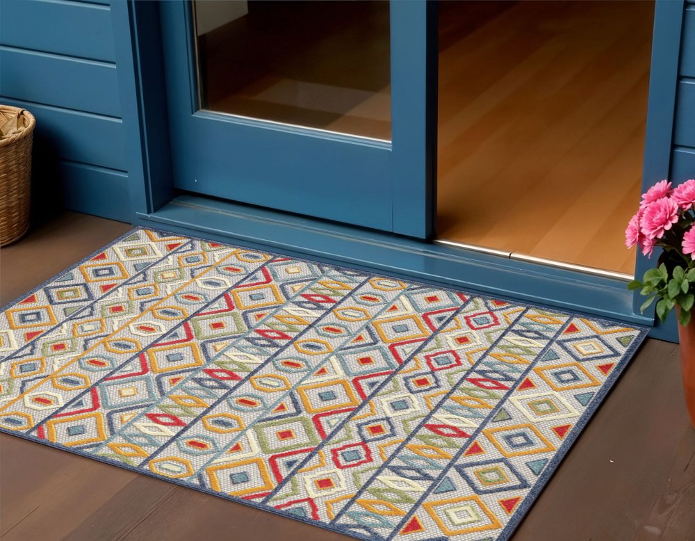 2' X 4' Ivory And Blue Southwestern Stain Resistant Indoor Outdoor Area Rug