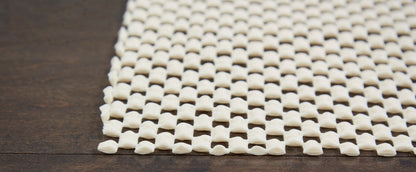 Cream rug with a square lattice pattern.