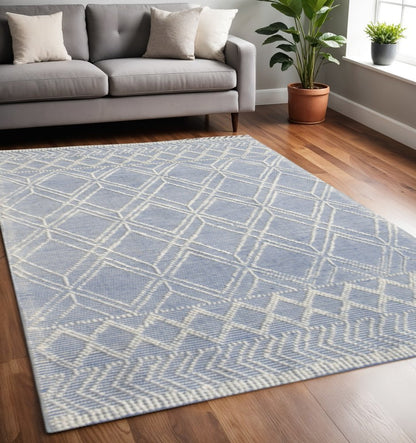 5' X 7' Blue and Ivory Geometric Handmade Area Rug