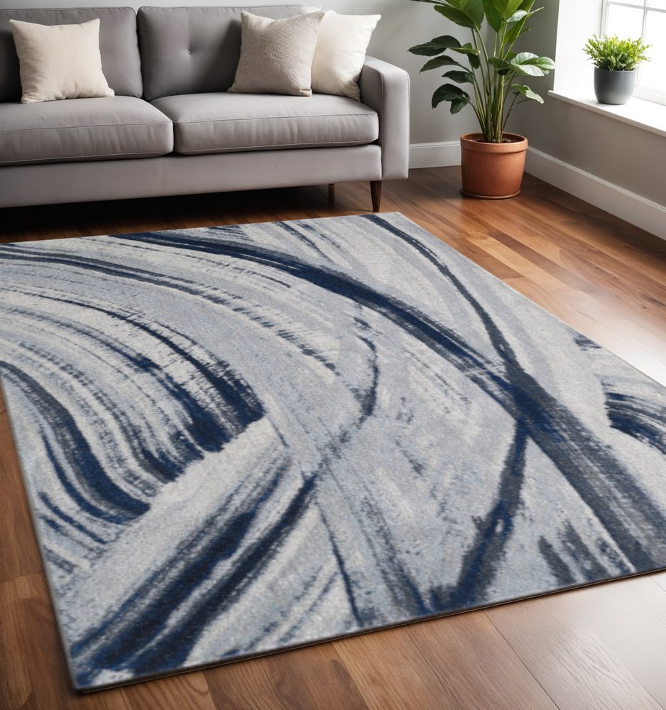 5' X 8' Ivory and Blue Abstract Area Rug