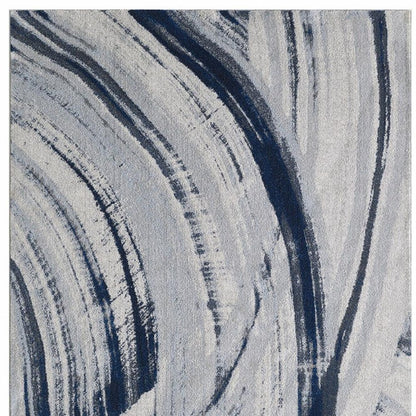7' X 10' Ivory and Blue Abstract Area Rug