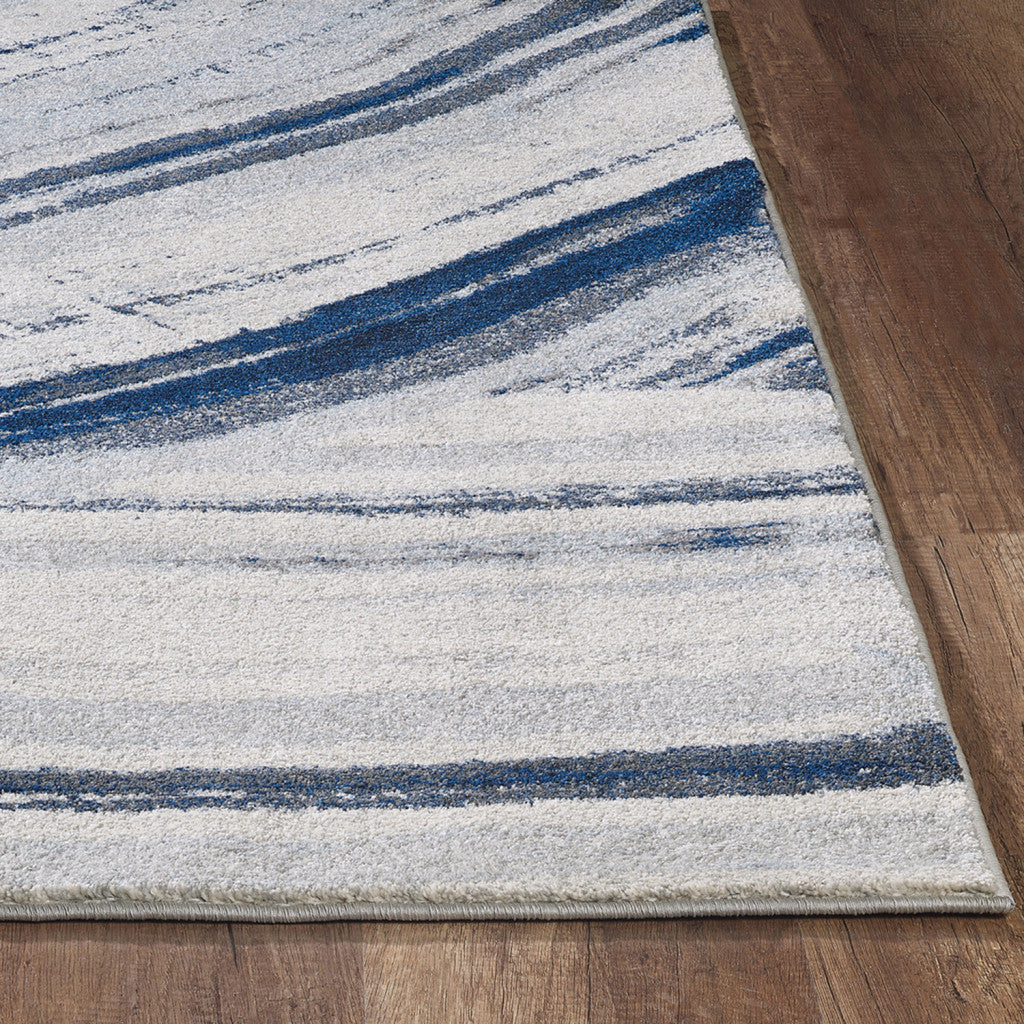 7' x 10' Ivory and Blue Abstract Area Rug