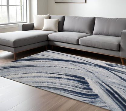 7' X 10' Ivory and Blue Abstract Area Rug