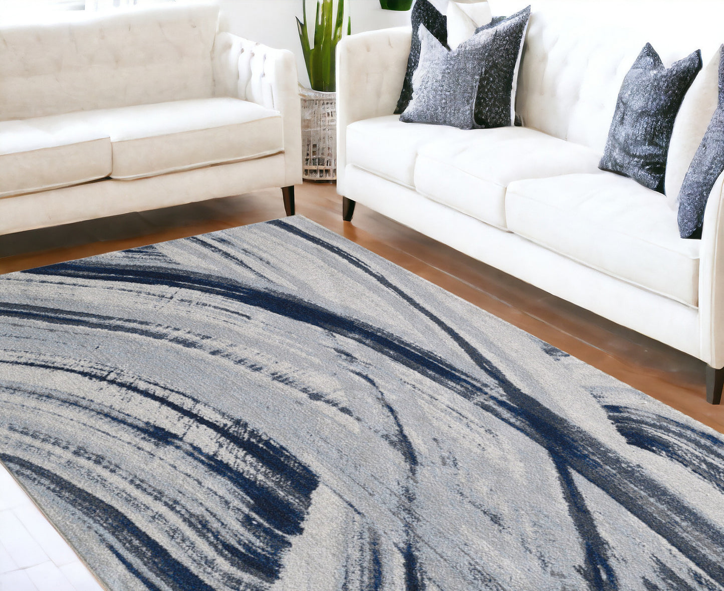 7' X 10' Ivory and Blue Abstract Area Rug