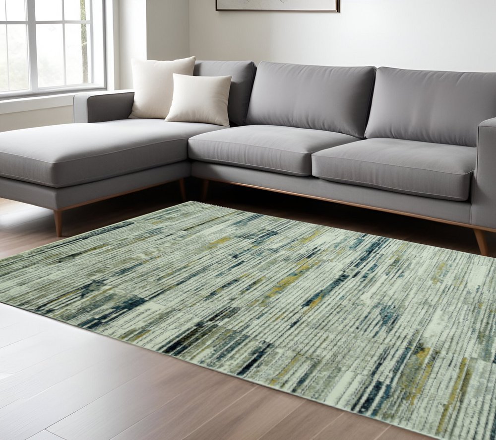 9' X 13' Ivory and Blue Abstract Area Rug