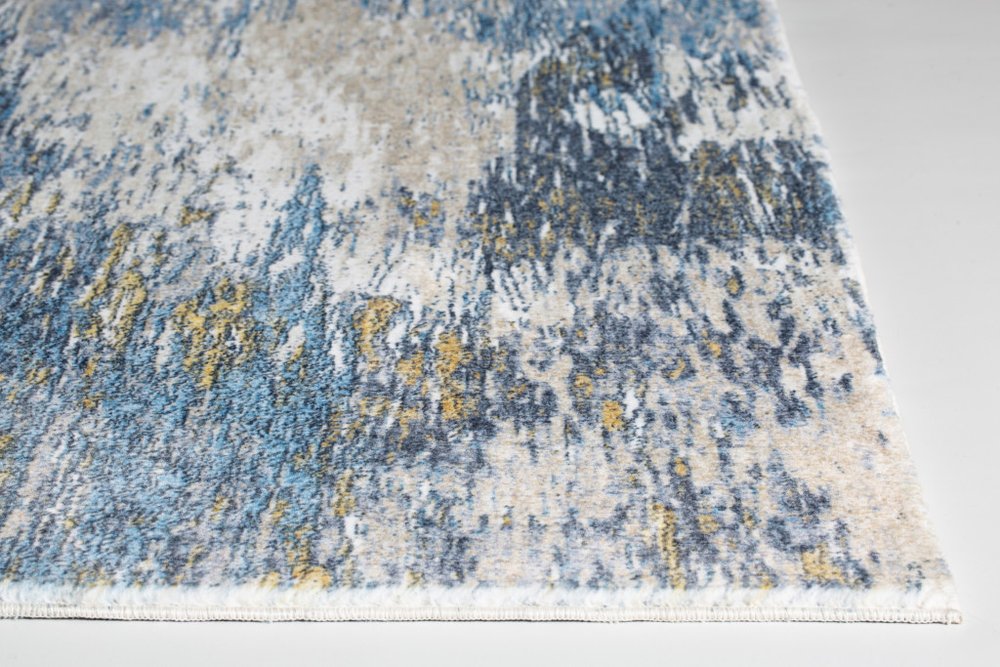Abstract blue and gold area rug with cream and gray accents, 6' x 9', rectangular modern decor piece.