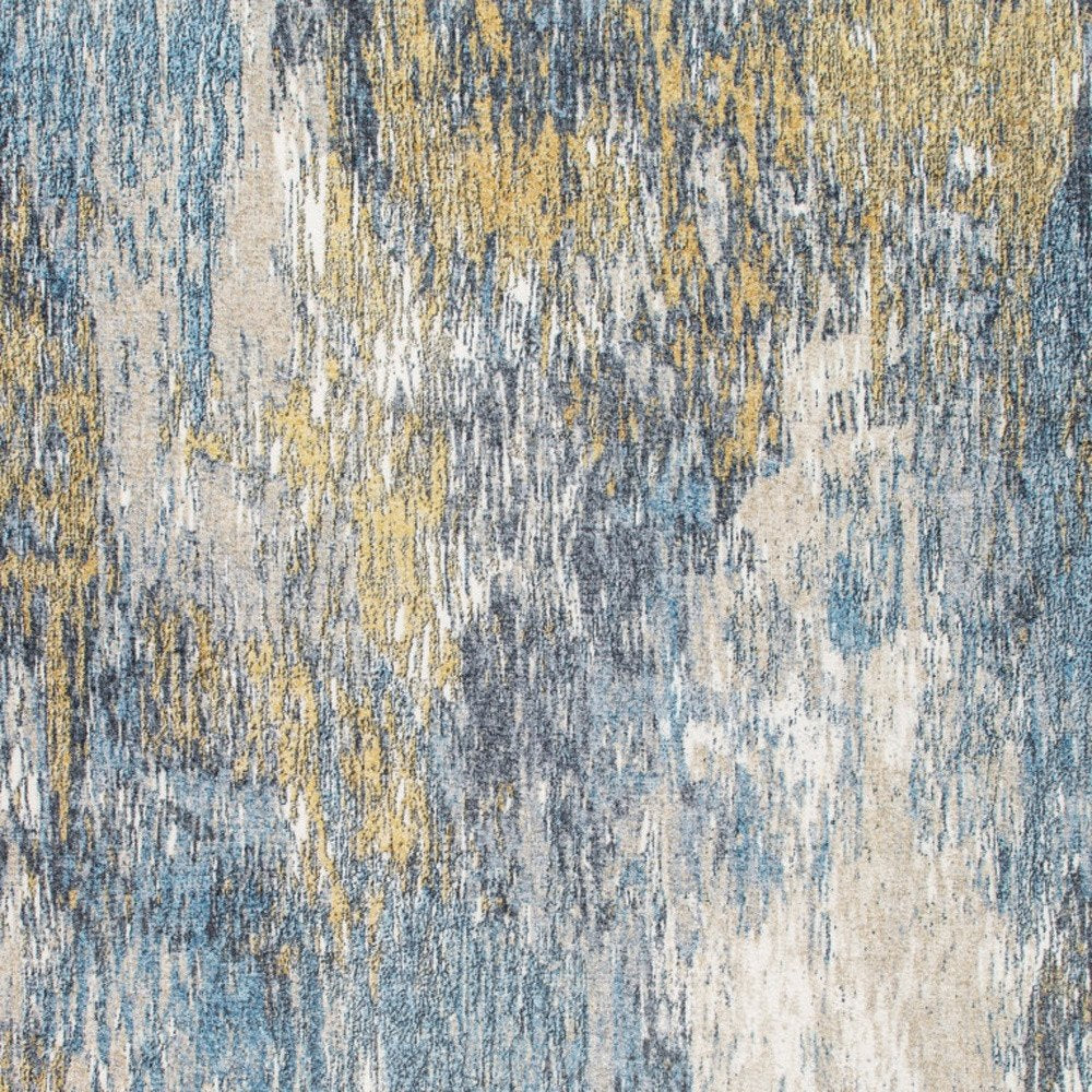 Rectangular area rug with abstract brushstroke pattern in blue, gray, cream & mustard yellow; textured modern home decor.