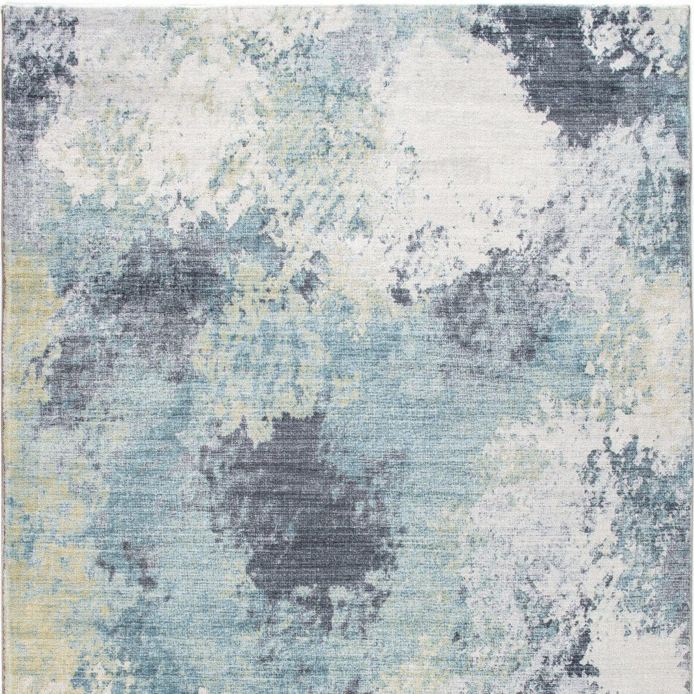 5' X 8' Blue and Ivory Abstract Area Rug
