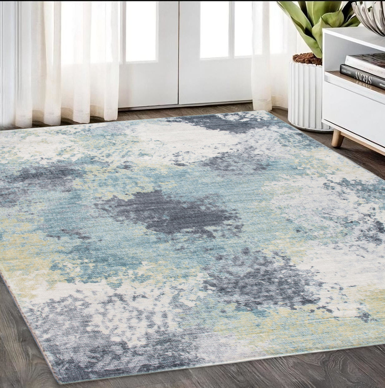 5' X 8' Blue and Ivory Abstract Area Rug