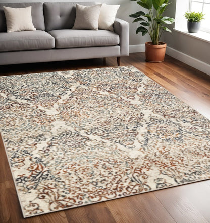 5' X 8' Ivory Rust And Green Oriental Area Rug