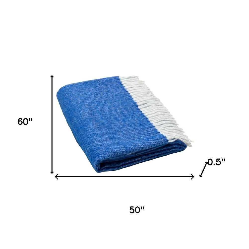 Blue throw blanket with white fringe, folded; 60" x 50" x 0.5" thickness.