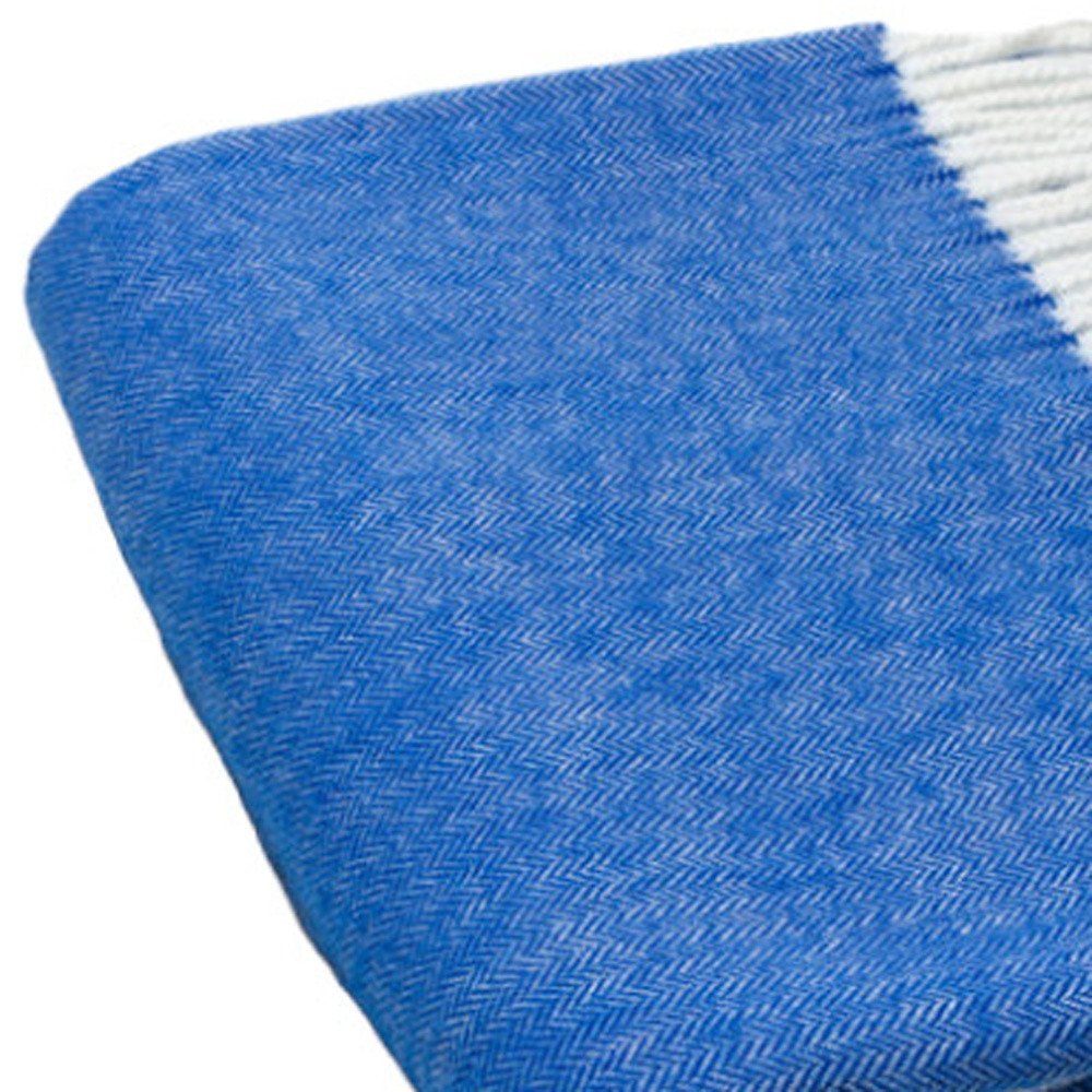 Bright cobalt blue woven towel with subtle herringbone texture.
