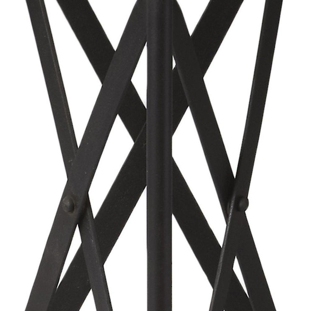Black metal industrial round end table with a round top supported by an X-pattern crisscross frame.