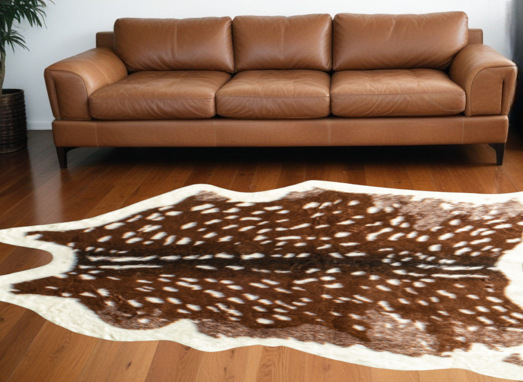5' X 8' Off White And Brown Faux Cowhide Tufted Washable Non Skid Area Rug