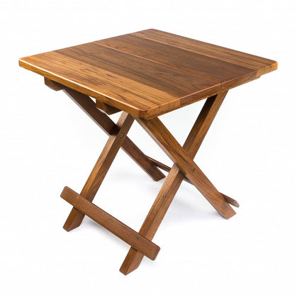 Wooden folding table with square plank top and X-frame legs in a warm brown finish.