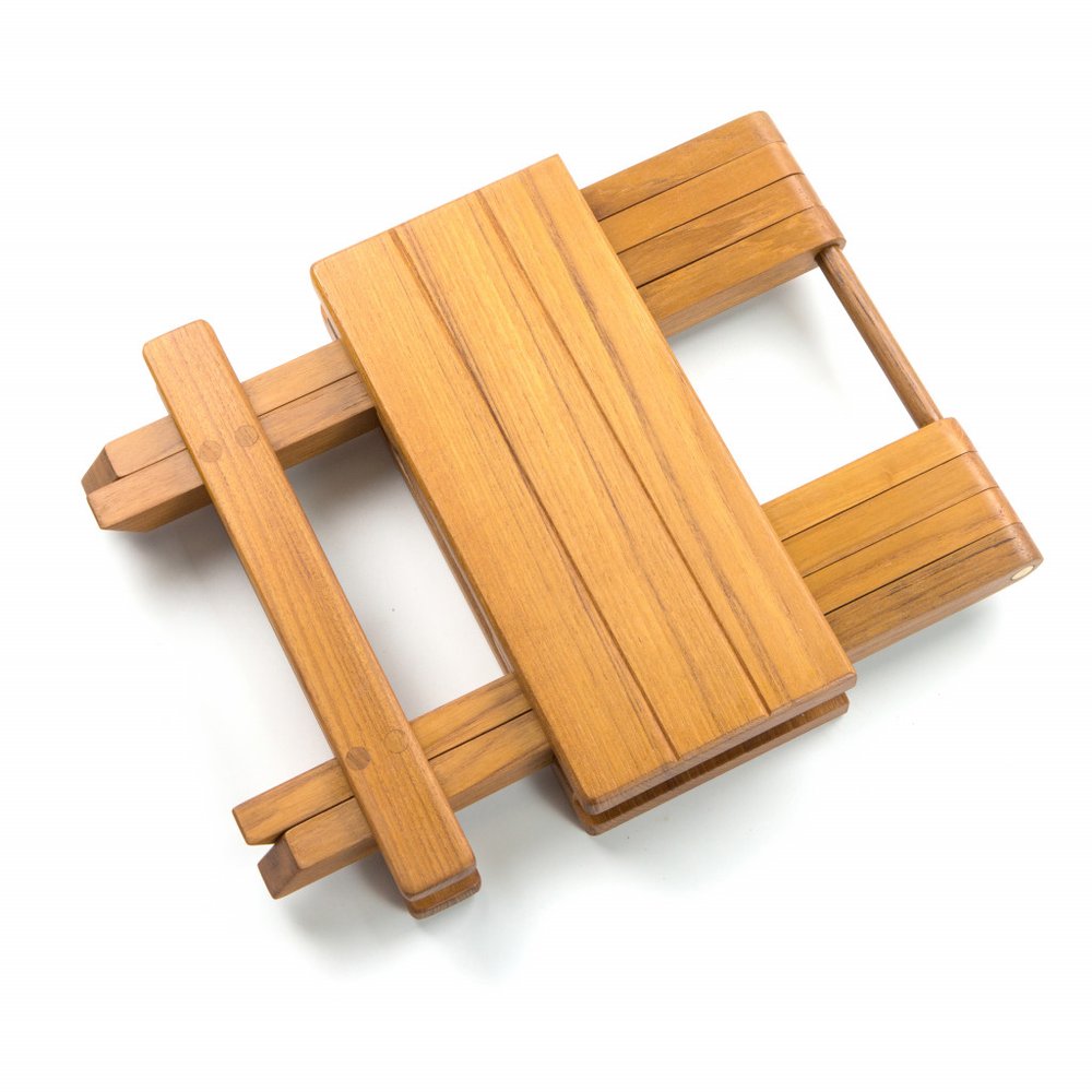 Honey-brown wooden device with a rectangular central plank and parallel side rails; rustic craft tool.