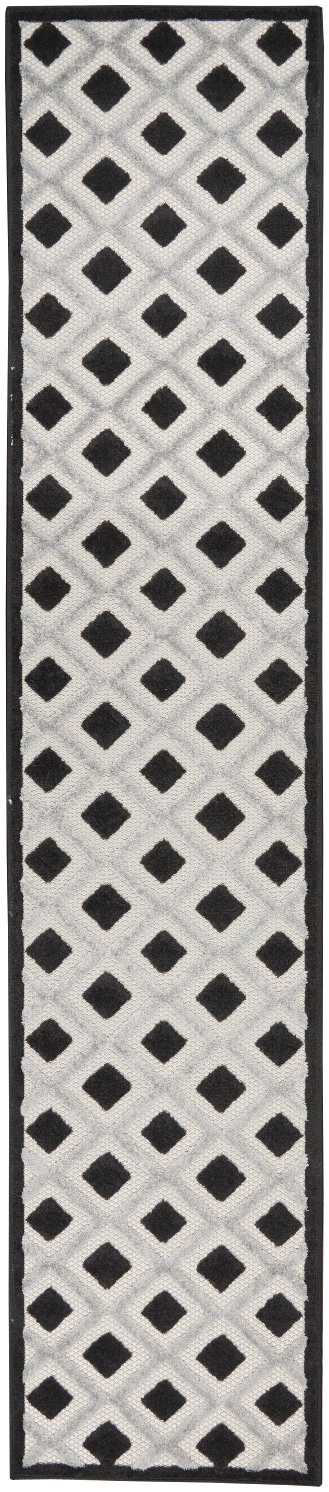 Rectangular tufted rug runner in white-gray lattice with black diamond motifs and black border; geometric hallway rug.