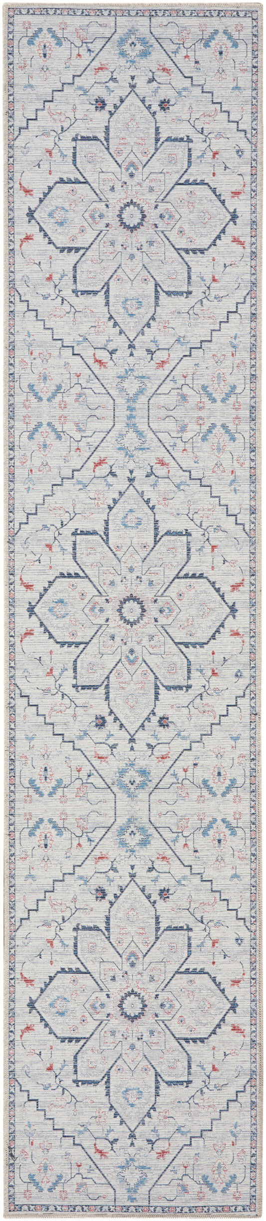Long runner rug with navy star medallions on pale blue with pink and teal floral accents, framed by a narrow blue border.