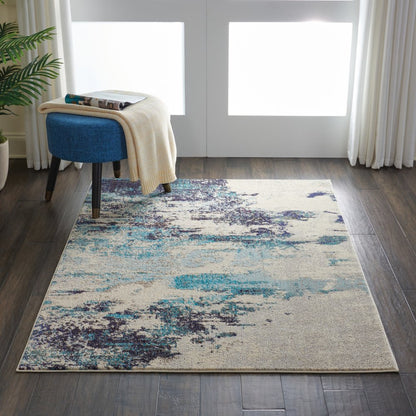 4' X 6' Ivory And Teal Blue Abstract Power Loom Non Skid Area Rug