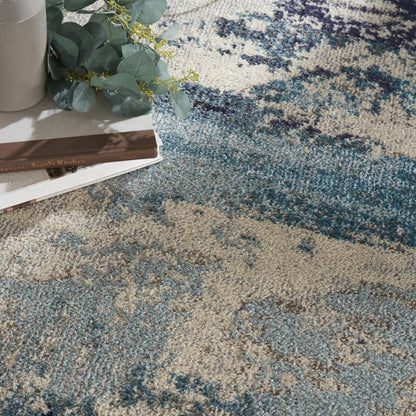 5' X 5' Ivory And Teal Blue Round Abstract Power Loom Non Skid Area Rug