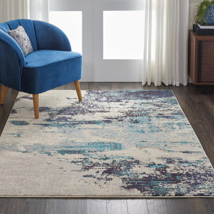 5' X 7' Ivory And Teal Blue Abstract Power Loom Non Skid Area Rug
