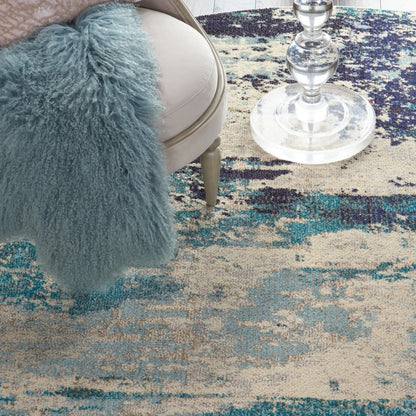 8' X 8' Ivory And Teal Blue Round Abstract Power Loom Non Skid Area Rug