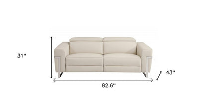 83" Beige Italian leather USB reclining sofa with silver legs.