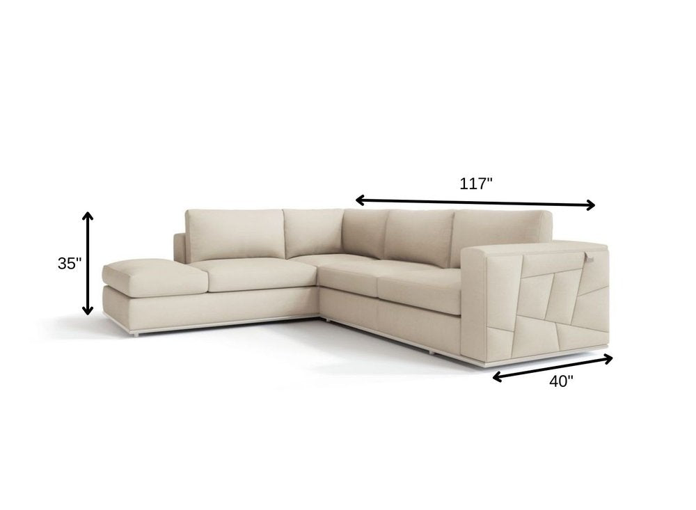 Beige Italian leather reclining L-shaped two-piece corner sectional with left chaise; modern cushions and a quilted right-arm panel, 117" long, 40" deep, 35" tall.