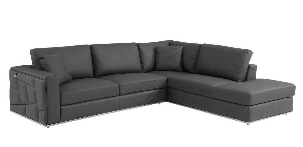 Dark gray Italian leather L-shaped sectional sofa with right chaise, plush cushions and slim metal legs.