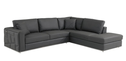 Dark gray Italian leather L-shaped sectional sofa with right chaise, plush cushions and slim metal legs.