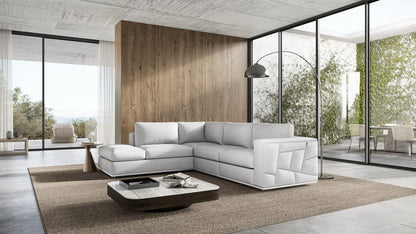 White Italian leather reclining L-shaped two-piece corner sectional.