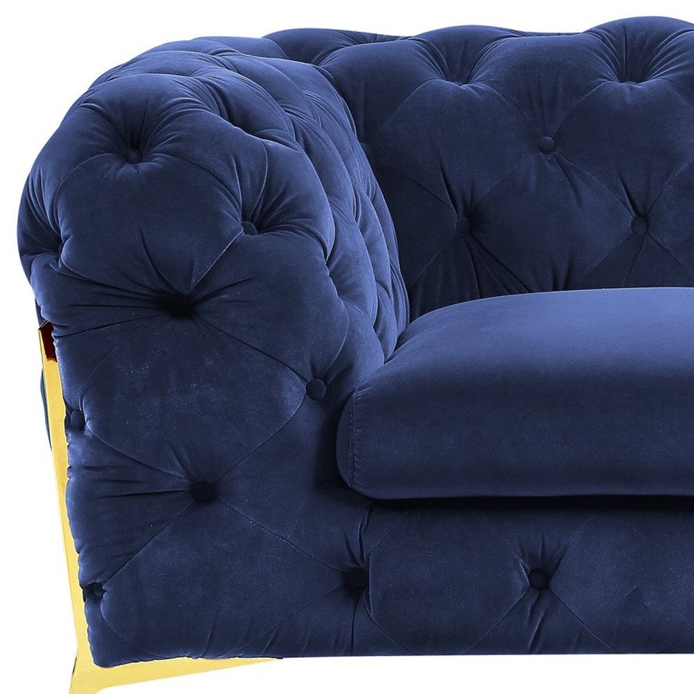 50" blue velvet tufted lounge chair with a gold-toned frame.