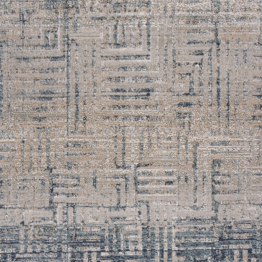 5' X 8' Cream Blue And Ivory Geometric Distressed Stain Resistant Area Rug