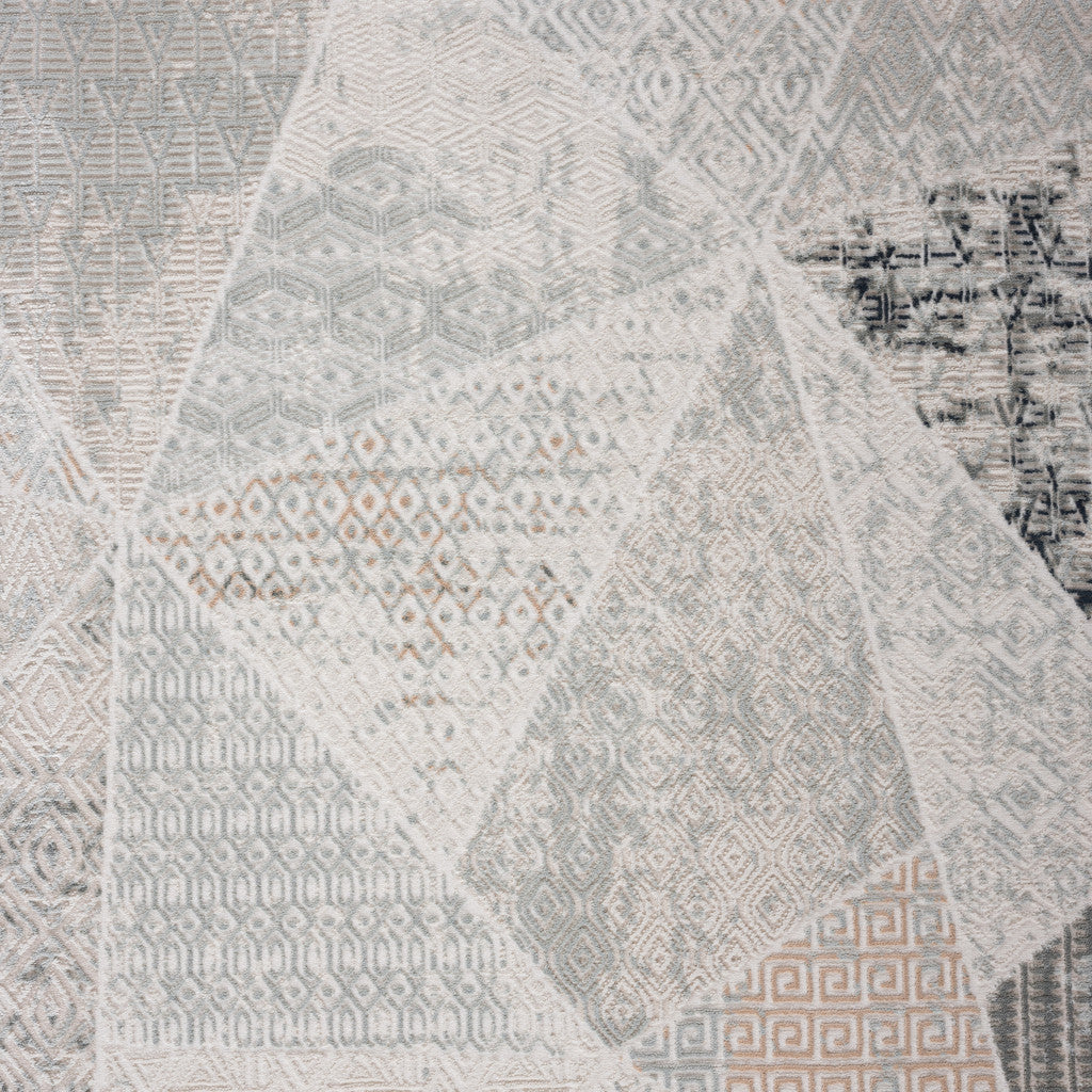 9' X 12' Gray Blue Taupe And Cream Geometric Distressed Stain Resistant Area Rug