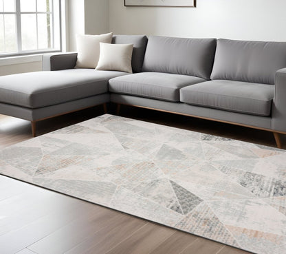 9' X 12' Gray Blue Taupe And Cream Geometric Distressed Stain Resistant Area Rug