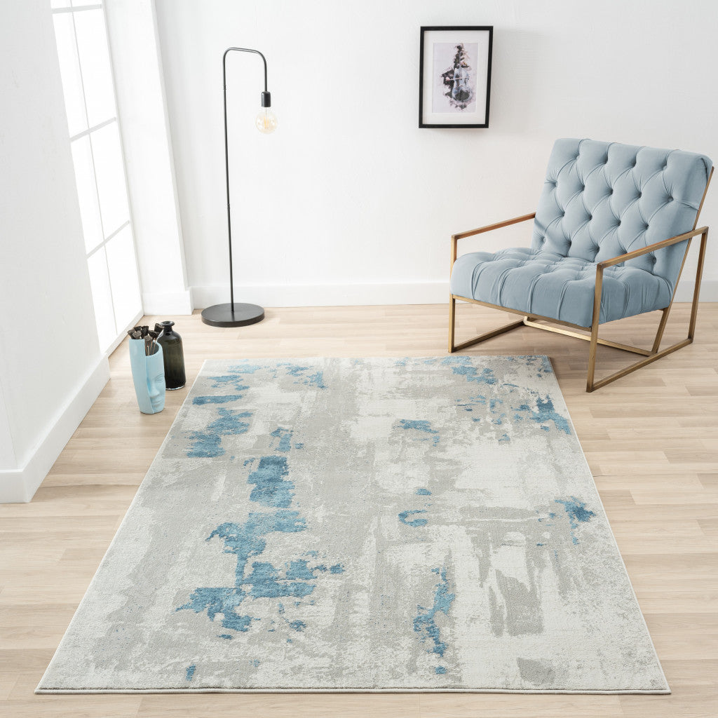 2' X 6' Ivory Gray And Blue Abstract Stain Resistant Area Rug