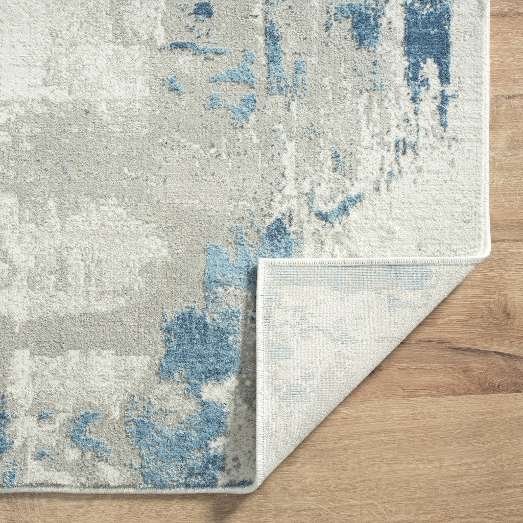 4' X 6' Ivory Gray And Blue Abstract Stain Resistant Area Rug