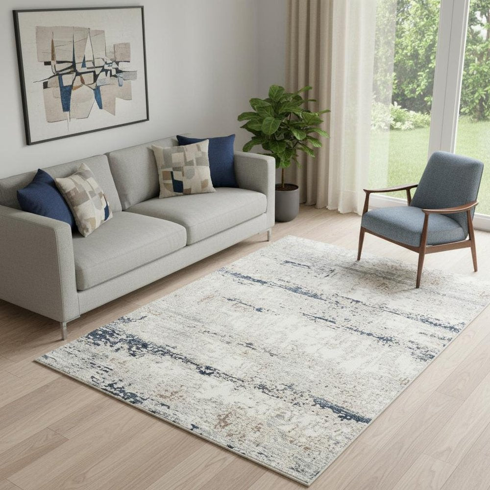 5' X 7' Beige Cream Blue And Gray Abstract Stain Resistant Area Rug