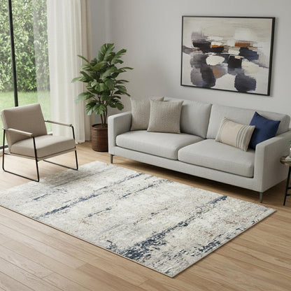 5' X 7' Beige Cream Blue And Gray Abstract Stain Resistant Area Rug