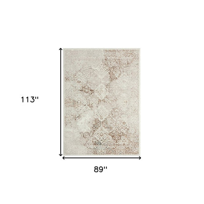 7' X 9' Beige Cream And Brown Damask Stain Resistant Area Rug