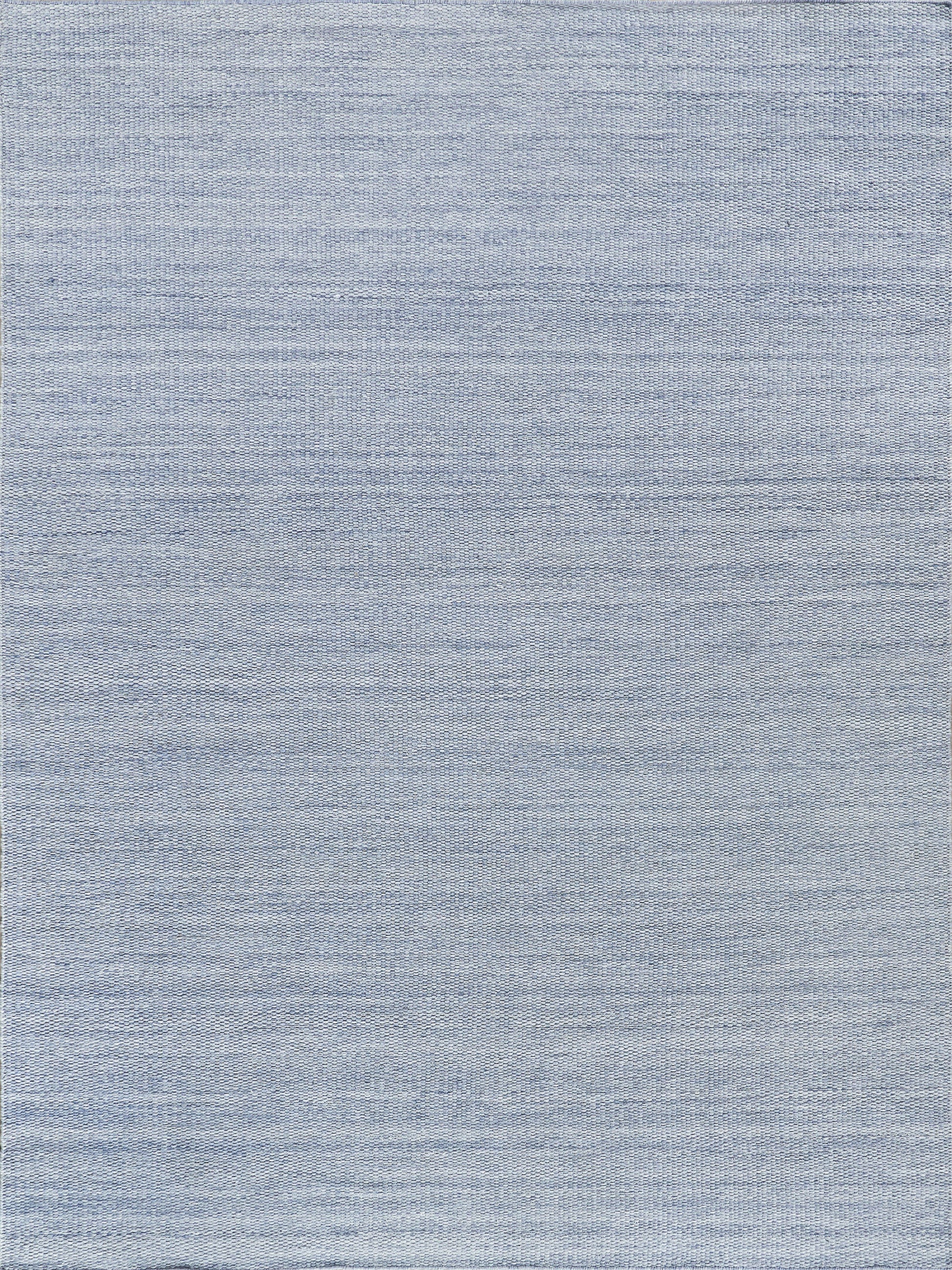 Light blue indoor/outdoor flat-weave rug with a subtle horizontal weave.