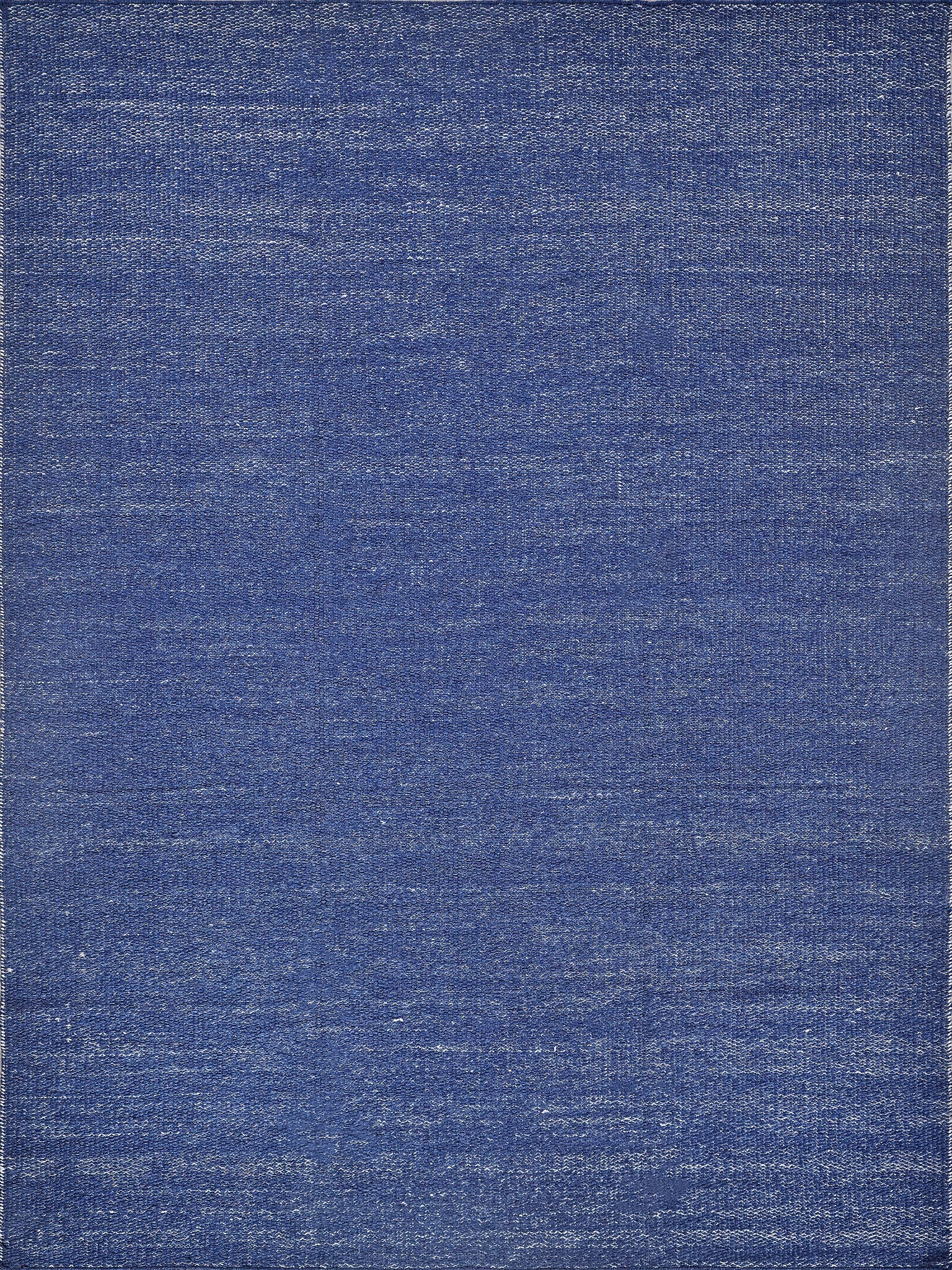 Blue flat-weave rug with subtle denim texture; durable, versatile rug for living room or hallway.