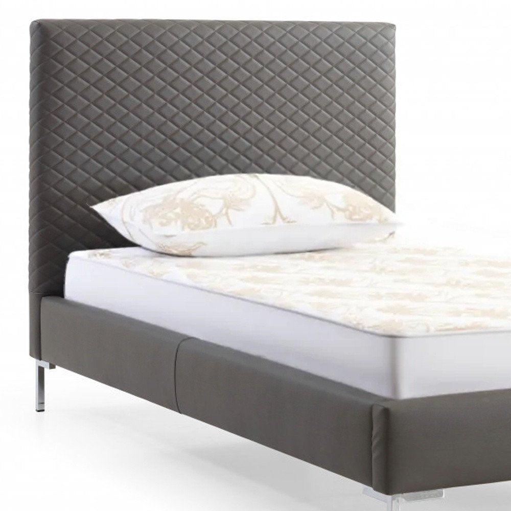 Gray and dark gray wood and faux leather twin bed frame.