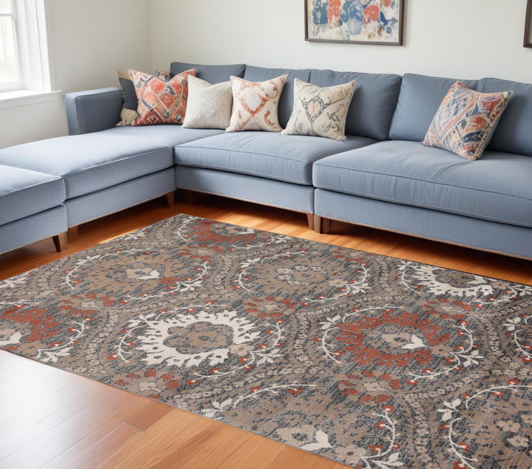 7' X 9' Rust Floral Stain Resistant Area Rug